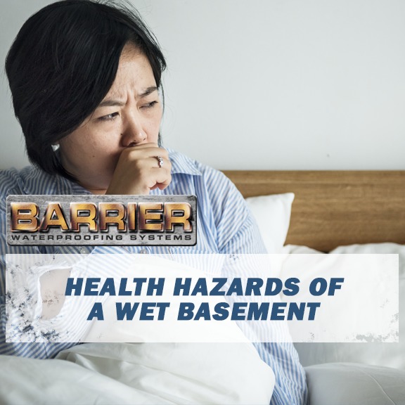 Woman coughing having gotten sick from bacteria growing in wet basement